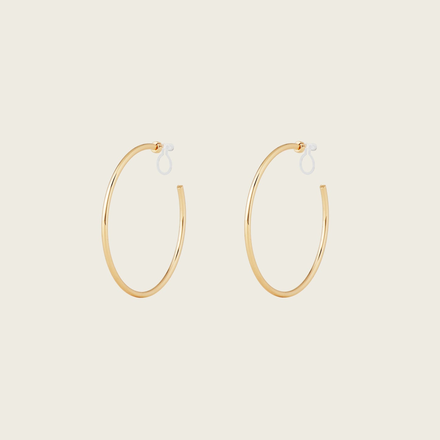 https://cdn.shopify.com/s/files/1/0569/3286/0096/files/LargeThinHoopsinGold_901c09bc-84a7-42b3-8bd3-203fb58c4d50.jpg?v=1754462432
