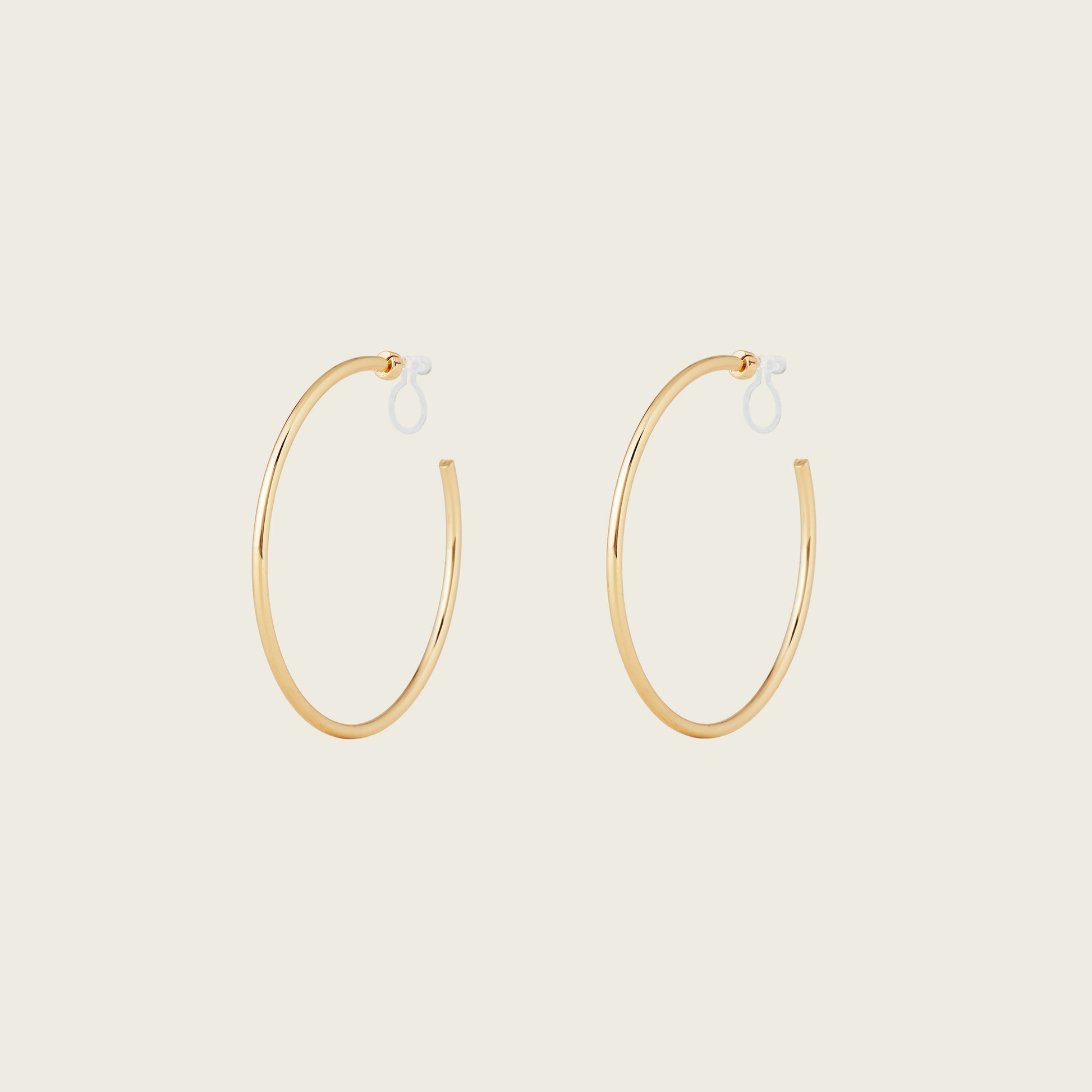 https://cdn.shopify.com/s/files/1/0569/3286/0096/files/LargeThinHoopsinGold_901c09bc-84a7-42b3-8bd3-203fb58c4d50.jpg?v=1754462432