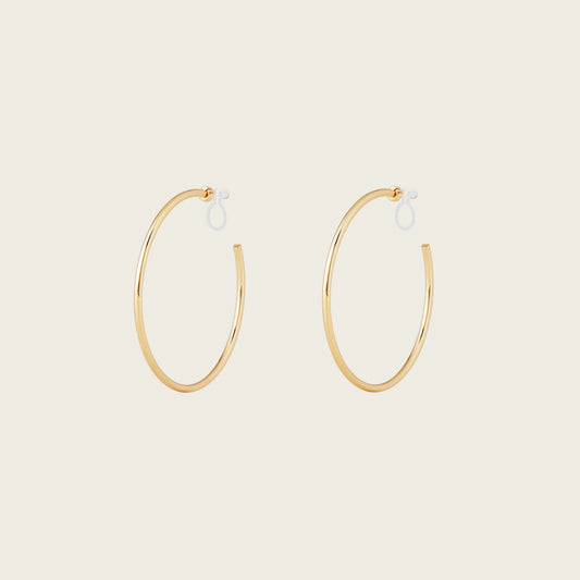 https://cdn.shopify.com/s/files/1/0569/3286/0096/files/LargeThinHoopsinGold_901c09bc-84a7-42b3-8bd3-203fb58c4d50.jpg?v=1754462432